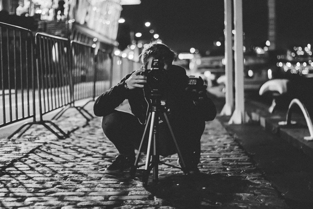photographer taking pictures in street