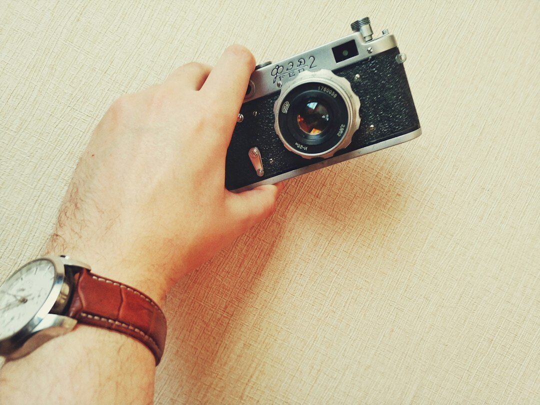 man with old camera